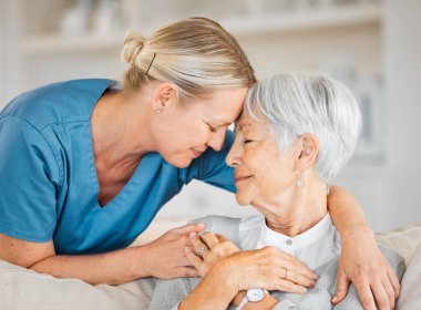a nurse caring for a senior woman at home. clipart