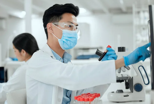 Doing high level research. a young male scientist working in a lab