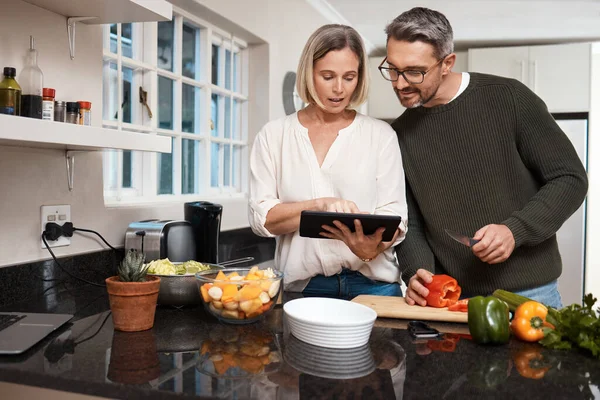Want Try Recipe Mature Couple Using Digital Tablet While Cooking — Fotografia de Stock