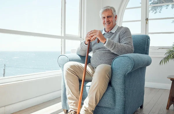 All I want in my golden years is to be safe. an elderly man enjoying the view from his window