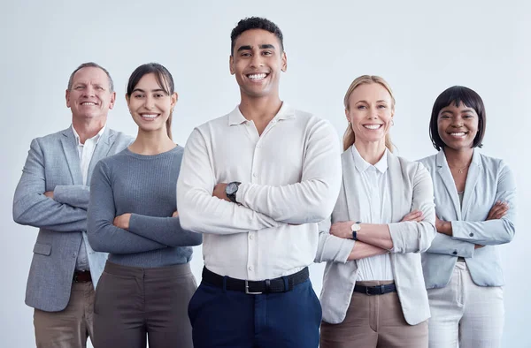 Position your team for a powerful impact. Portrait of a group of businesspeople working in a modern office