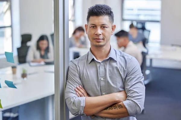 I lead a great team. a mature businessman standing with his arms crossed in an office at work