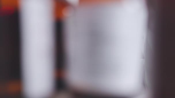 Young Scientist Removing Chemical Bottle Cabinet While Working Laboratory Alone — Αρχείο Βίντεο