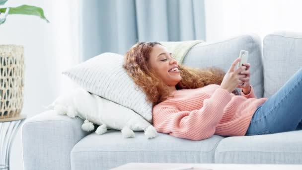 Woman Checking Her Phone Lying Resting Couch Happy Young Female — Vídeos de Stock