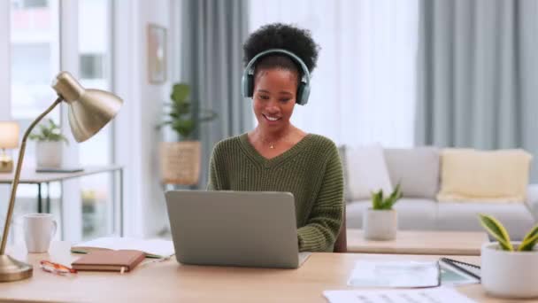 Black Woman Enjoying Music Wearing Headphones Using Laptop Home Office — Stockvideo