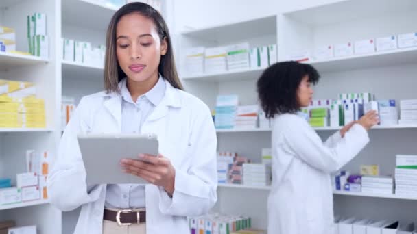 Pharmacist Digital Tablet While Doing Stock Update Counting Inventory Colleague — Stockvideo
