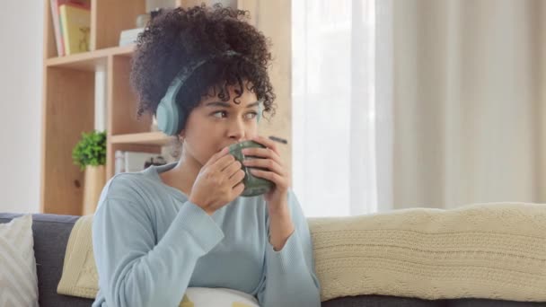 Woman Listening Music Headphones Educational Podcast While Thinking Drinking Cup — Videoclip de stoc