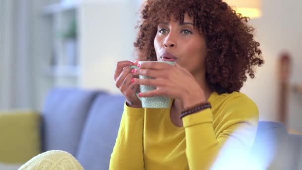 Trendy Woman Enjoying Coffee Blowing Cool While Relaxing Home African — Αρχείο Βίντεο