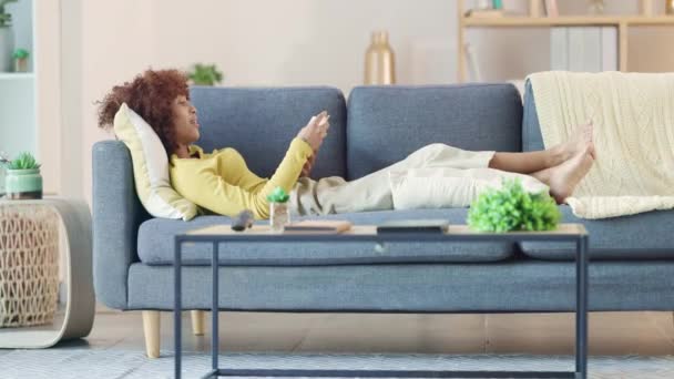 Relaxed Black Woman Reading Funny Book Sofa Home Young Female — Vídeos de Stock