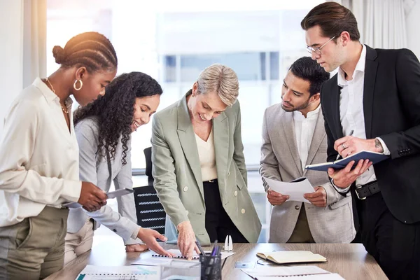 Brainstorming Happens Diverse Group Businesspeople Using Technology Looking Paperwork Meeting — Stock Photo, Image