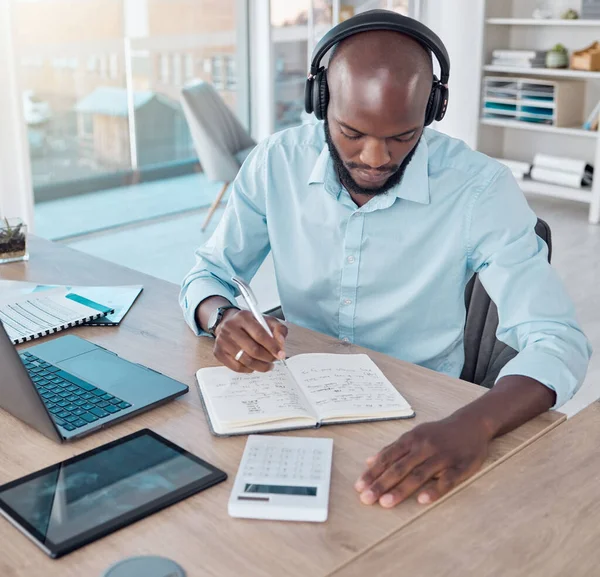 Putting Pen Paper Young Businessman Making Notes While Listening Music – stockfoto