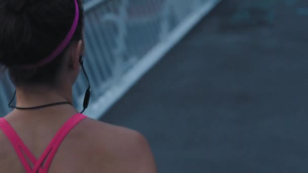Fit Athlete Running Listening Music Earphones While Training Exercising Evening — стоковое видео