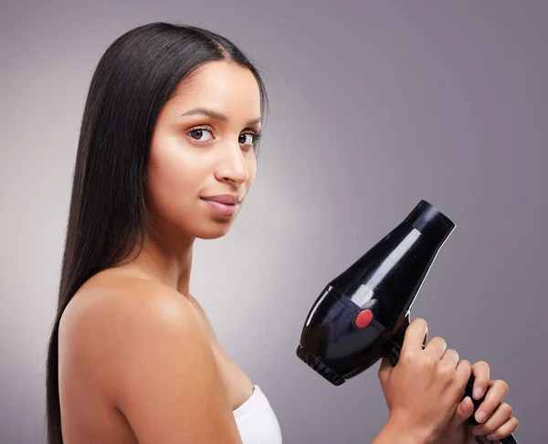 Secret Weapon Attractive Young Woman Standing Alone Studio Holding Hairdryer — Foto Stock