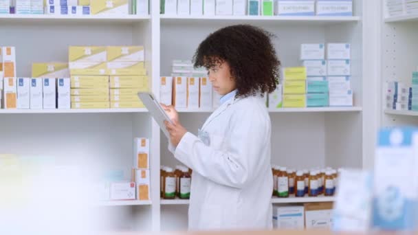 Young Focused Pharmacist Use Her Tablet Stock Taking Modern Pharmacy — Vídeo de Stock