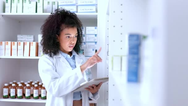 Female Pharmacist Doing Stock Take Medication Typing Digital Tablet While — Vídeo de Stock