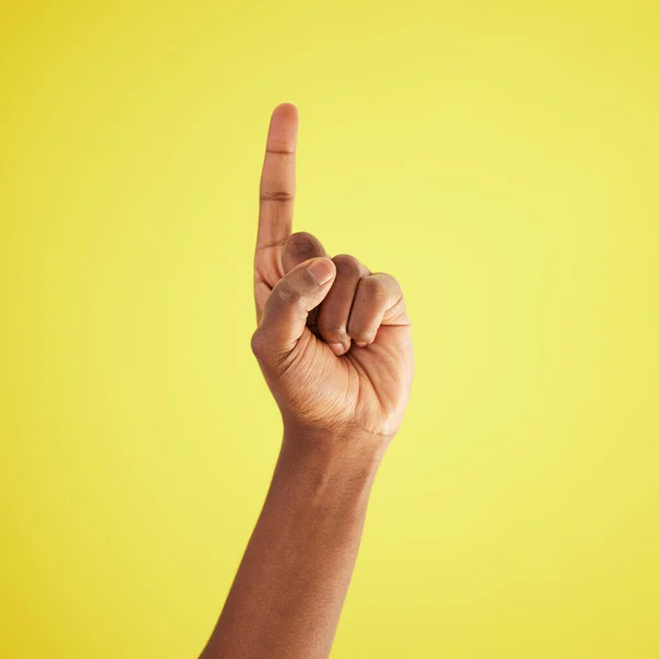 Ill Studio Shot Unrecognisable Man Pointing Upwards Yellow Background — Stockfoto