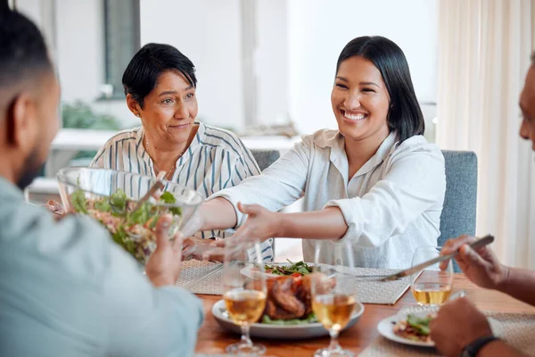 Kindness comes in the simplest ways. a family having lunch together at home