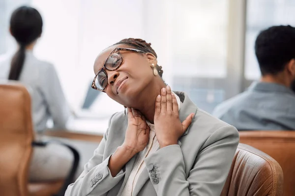 Neck pain can be caused by working in a twisted posture. a young businesswoman experiencing neck pain while working in an office