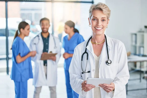Success Doing Getting Mature Female Doctor Standing Hospital —  Fotos de Stock