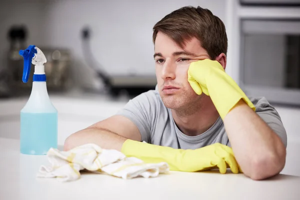 Chores Never Stop Young Man Looking Bored While Cleaning Kitchen — Fotografia de Stock