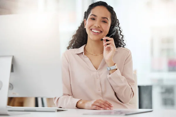 Its my aim to leave the customer with a positive experience. Portrait of a young call centre agent working on a computer in an office