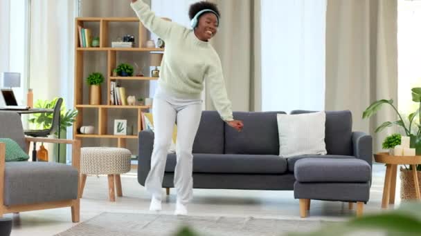 Woman Dancing Fun Songs While Wearing Headphones Alone Living Room — стоковое видео