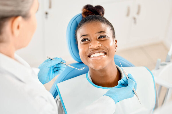 Youve really been caring for your teeth. a young woman at her dental checkup
