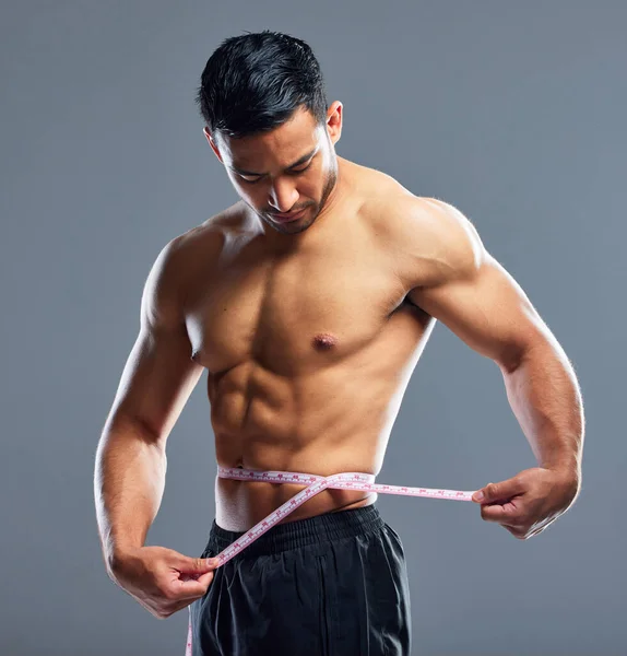 Take Care Your Physique Studio Shot Muscular Young Man Measuring — Fotografia de Stock