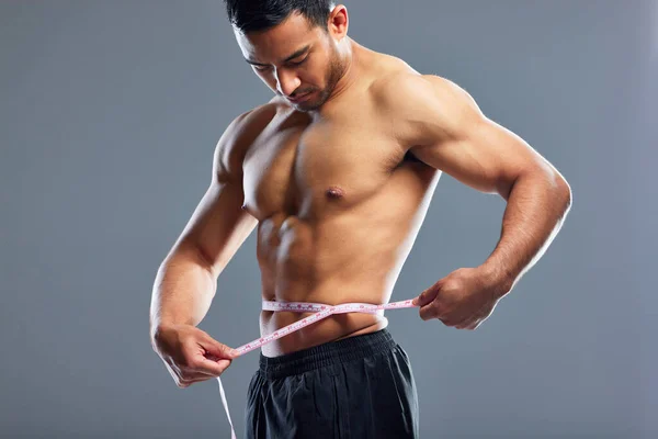 Body Goals Fleek Studio Shot Muscular Young Man Measuring His — Stockfoto