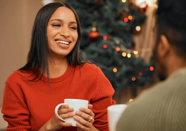 The best gift is realising how much you already have. a young woman having a warm drink while bonding with her partner at home