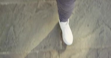 4k video footage of an unrecognizable man walking outside.