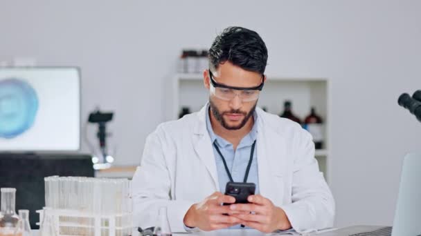 Happy Scientist Researching Statistics Medical Journals Phone Wearing Safety Glasses — 비디오