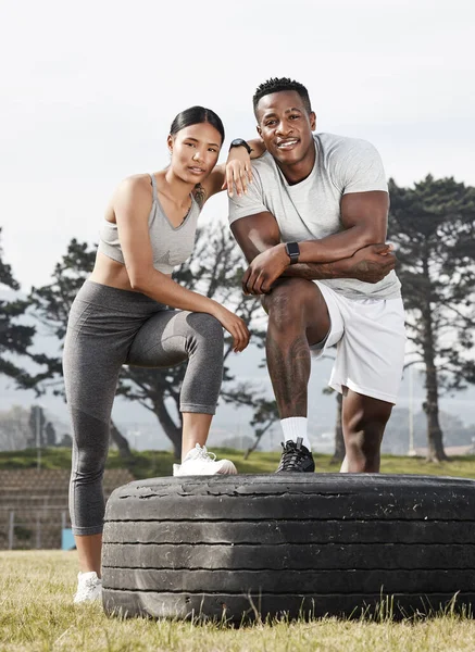 Well reach our fitness goals by motivating each other. an athletic man and woman standing together outside