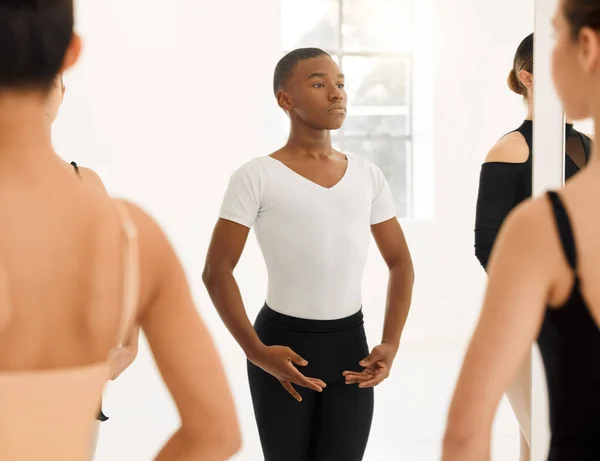 Dance is the hidden language of the soul. a group of ballet dancers practicing a routine in a dance studio