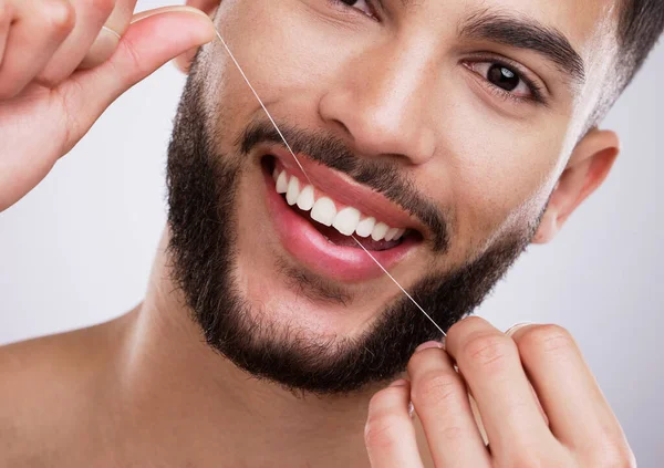 Smile Winning Feature Young Man Flossing His Teeth Studio Background — Fotografia de Stock
