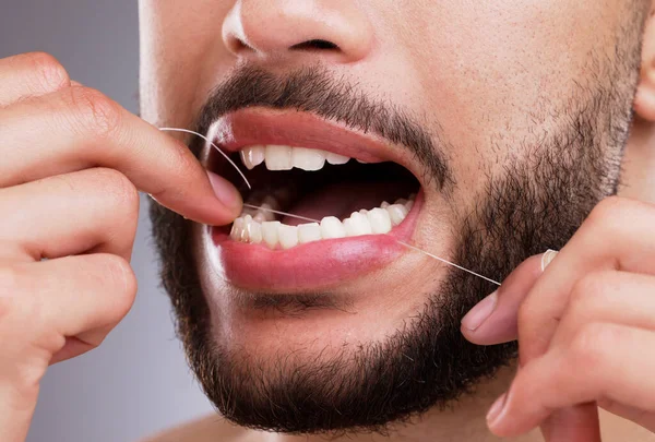 Thorough Flossing Man Flossing His Teeth Studio Background — Foto de Stock