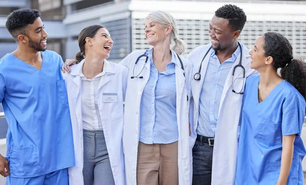 Laughter is a good remedy. a group of doctors standing against a city background