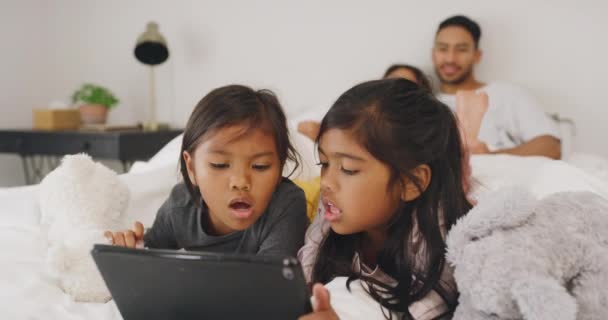 Little Girls Learning Browsing Digital Tablet While Sitting Bed Parents — Stockvideo