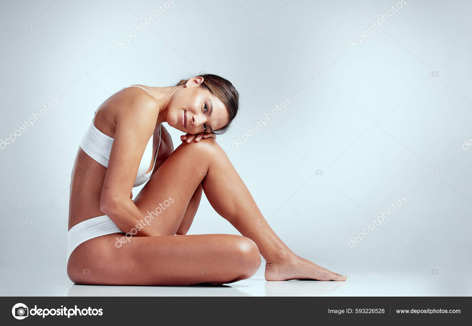 Confident Content Studio Portrait Attractive Young Woman Sitting