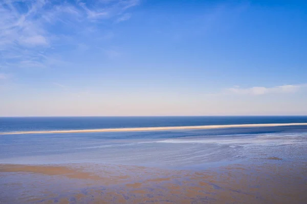 stock image Beautiful landscape of an empty beach against a blue sky background on a summer morning. A peaceful and quiet view of the ocean and the sea shore with copy space on a spring day.