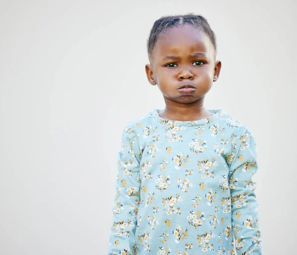 Mom said that Ill be on the naughty list this year. an adorable little girl standing against a white background