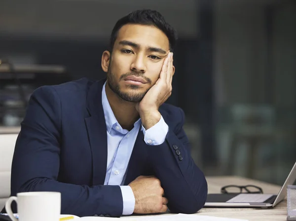 Tired businessman on the stock market, trading during a financial crisis. Bored trader in a bear market, looking at stocks crashing. Market crash, stock default and economy failure or depression.