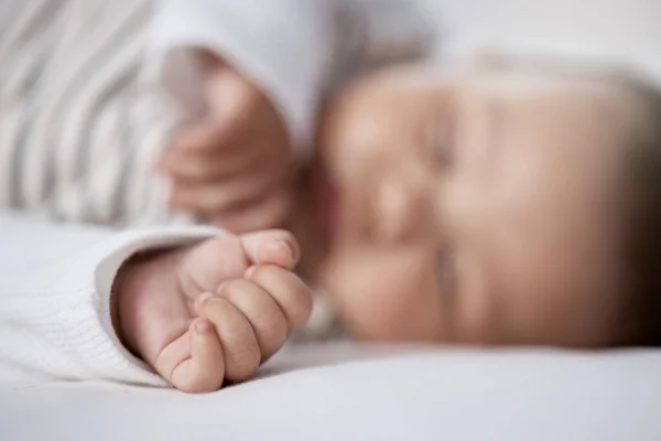 Babies Need Lots Sleep Grow Closeup Shot Babys Hand While — Fotografia de Stock