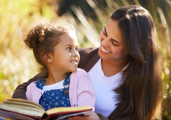 You Wanna Try Attractive Young Woman Reading Her Daughter While — ストック写真