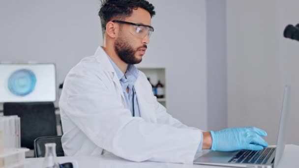 Adult Male Scientist Working Laptop Entering Scientific Data Focused Working — Stockvideo