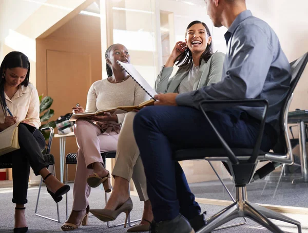 Meetings make us successful. a diverse group of businesspeople sitting in the boardroom during a meeting