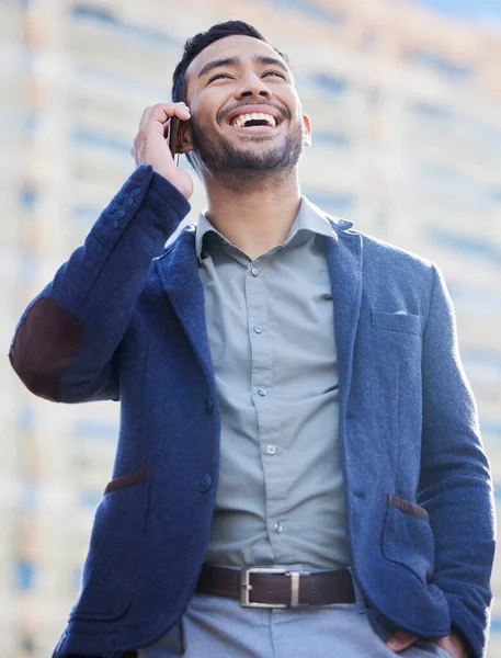 I missed hearing your voice. a handsome young businessman using a smartphone to make a call
