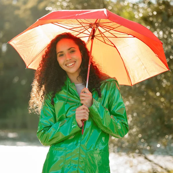 Is there anything more delicious than a rainy day. a beautiful young woman spending a day outside in the rain