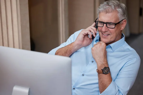 Looking Figures Speak Mature Businessman Sitting Alone Office Using His — Foto de Stock