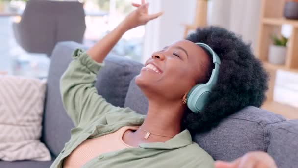 Happy Carefree Relaxed Woman Listening Music Headphones While Sitting Sofa — Stockvideo